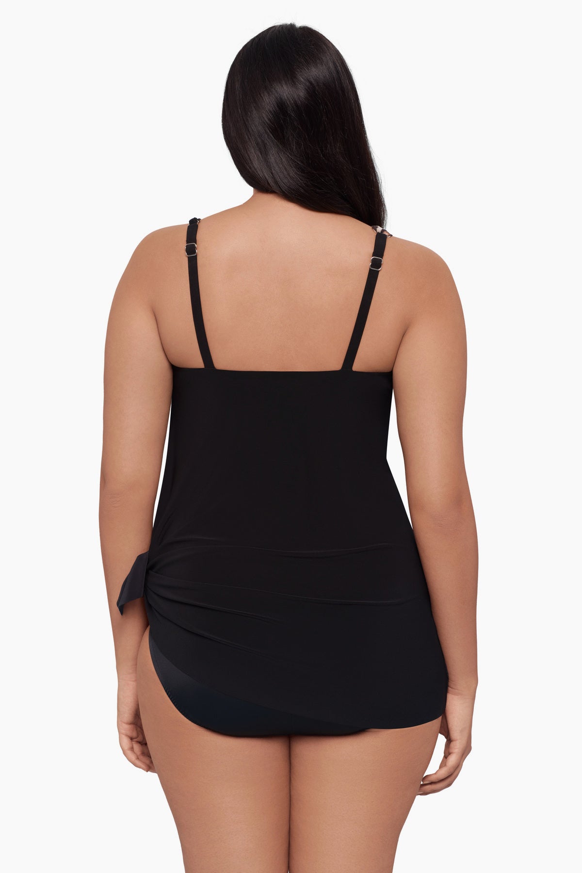 Woman faced away wearing a swim dress 
