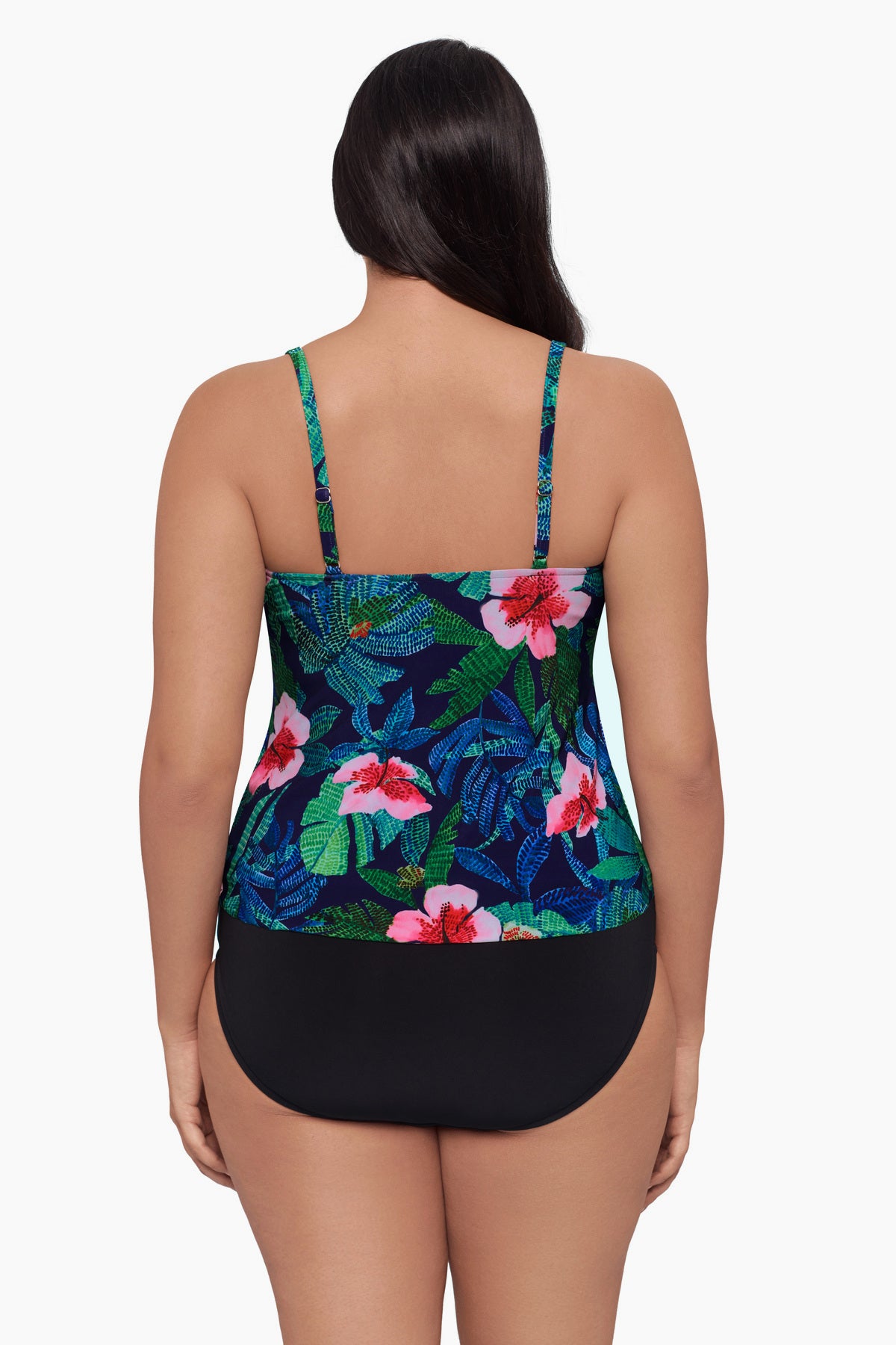 Woman faced away wearing a tankini top with a floral print