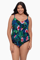 Woman wearing a tankini top with a floral print