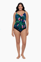 Woman wearing a tankini top with a floral print