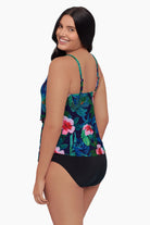 Woman faced left wearing a tankini top with a floral print