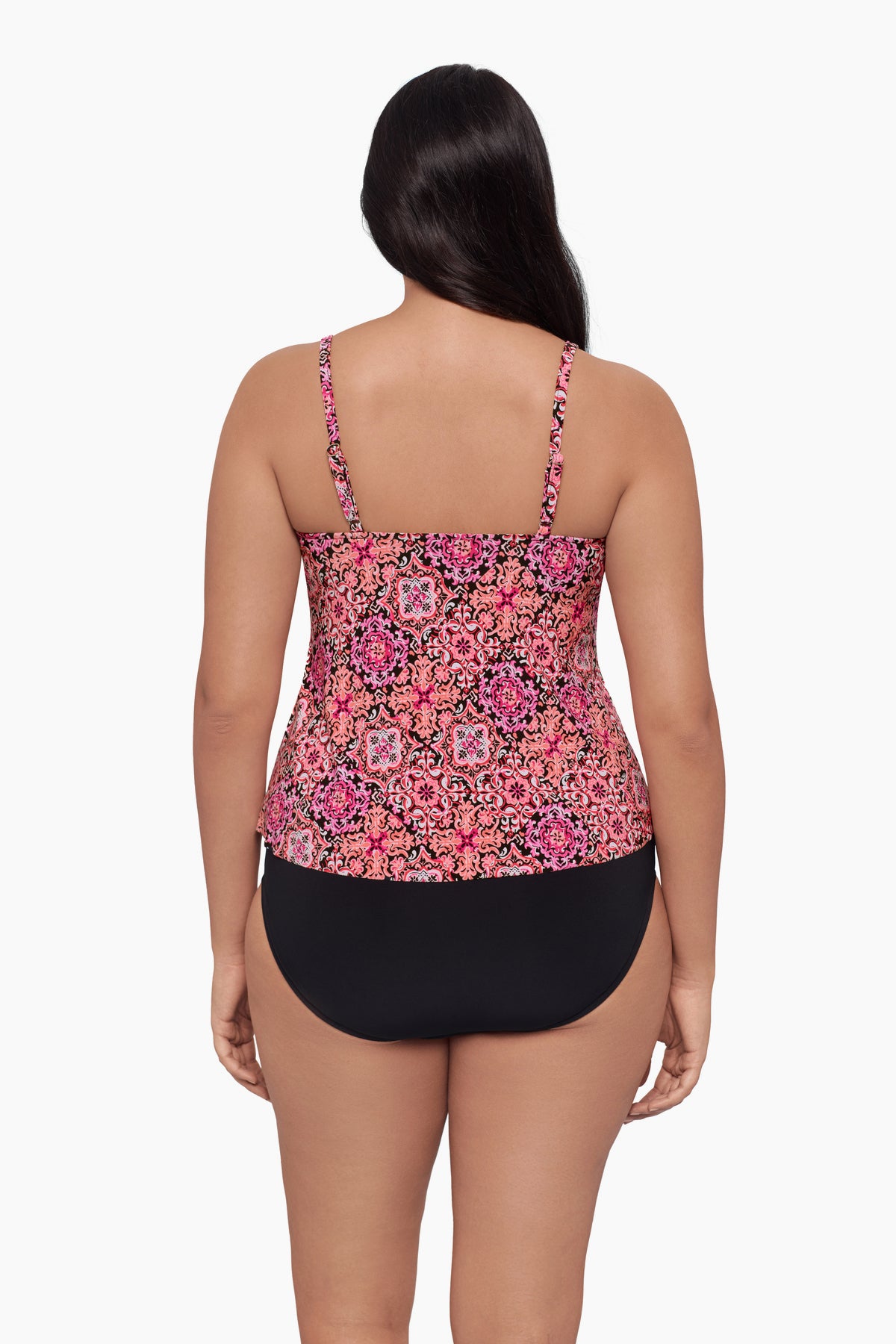 Woman faced away wearing a tankini top with a pink tile pattern