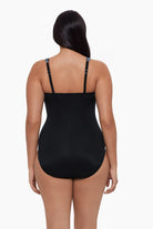 Woman turned away wearing one-piece swimsuit 