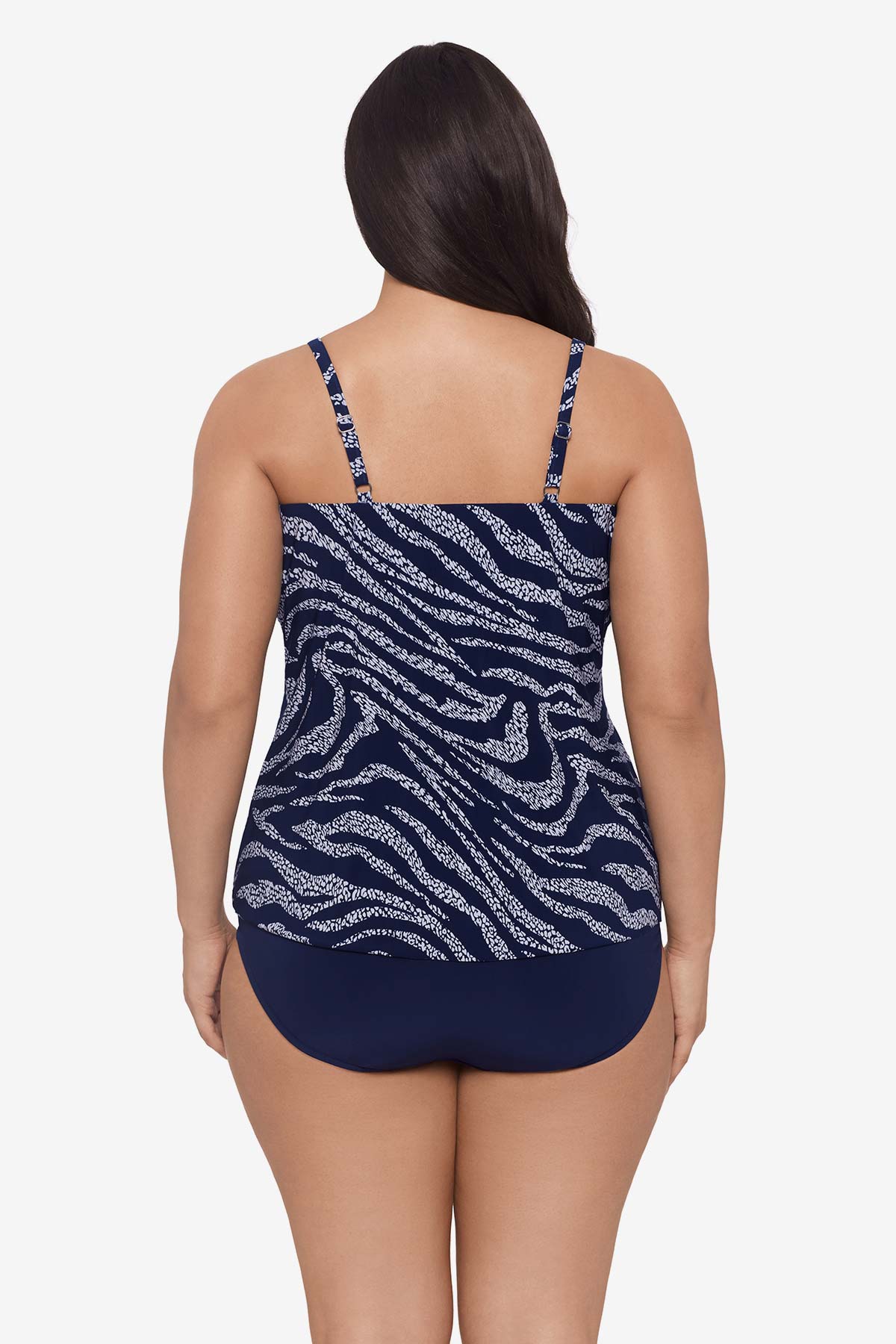 Woman faced away wearing an animal-esque printed tankini top