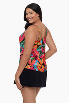 Woman turned left wearing a tankini top with a multicolored floral print