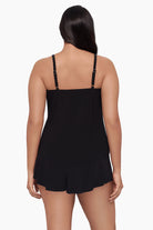 Woman turned away wearing a tankini top 