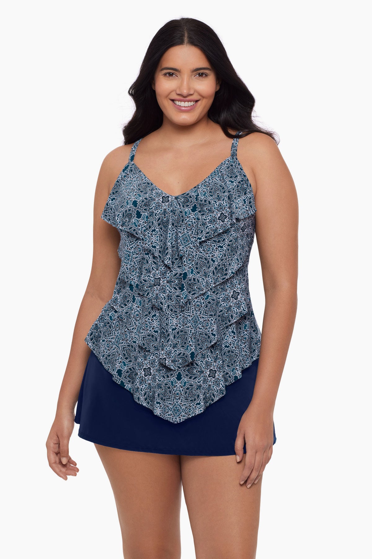 Woman wearing a tankini top with a blue tile print