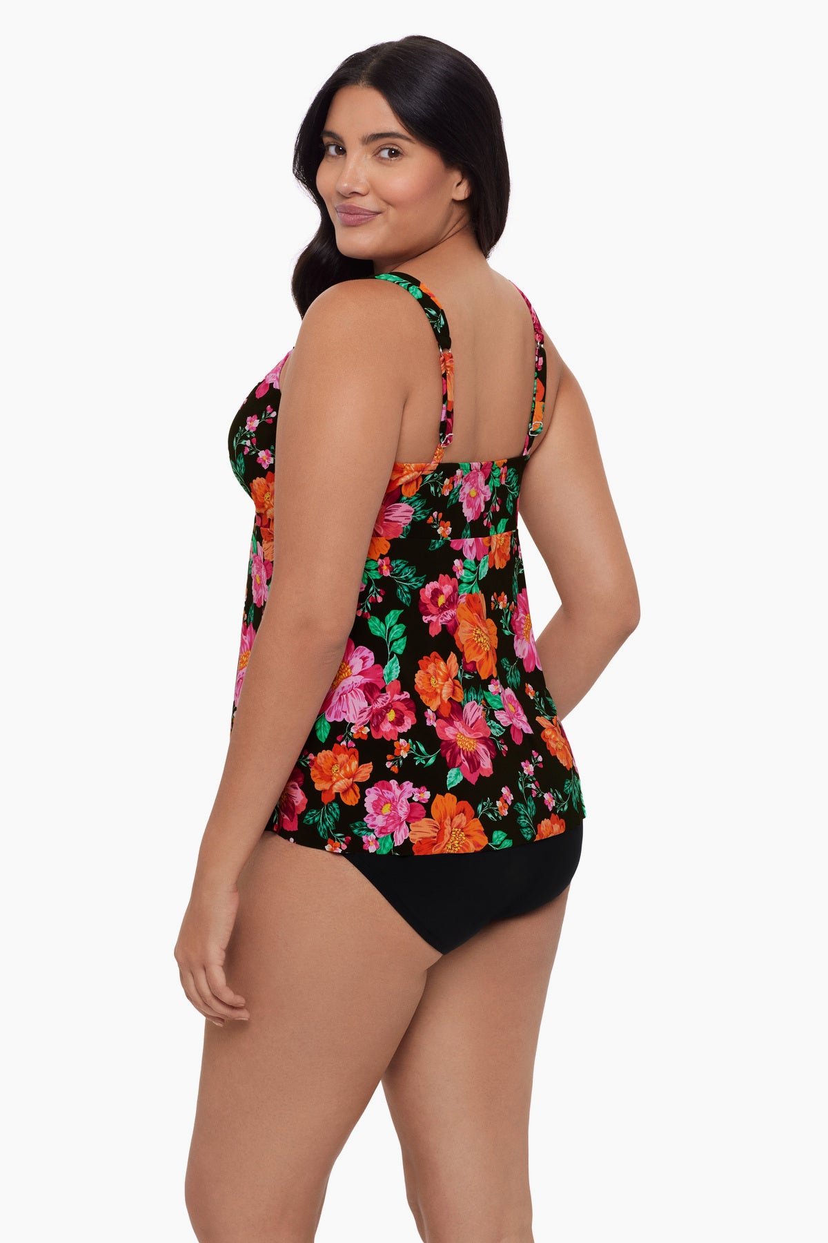 Woman turned left wearing a red and pink floral printed tankini top