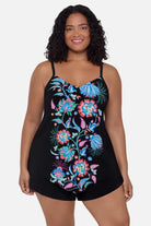 Woman wearing a blue and pink floral print tankini top