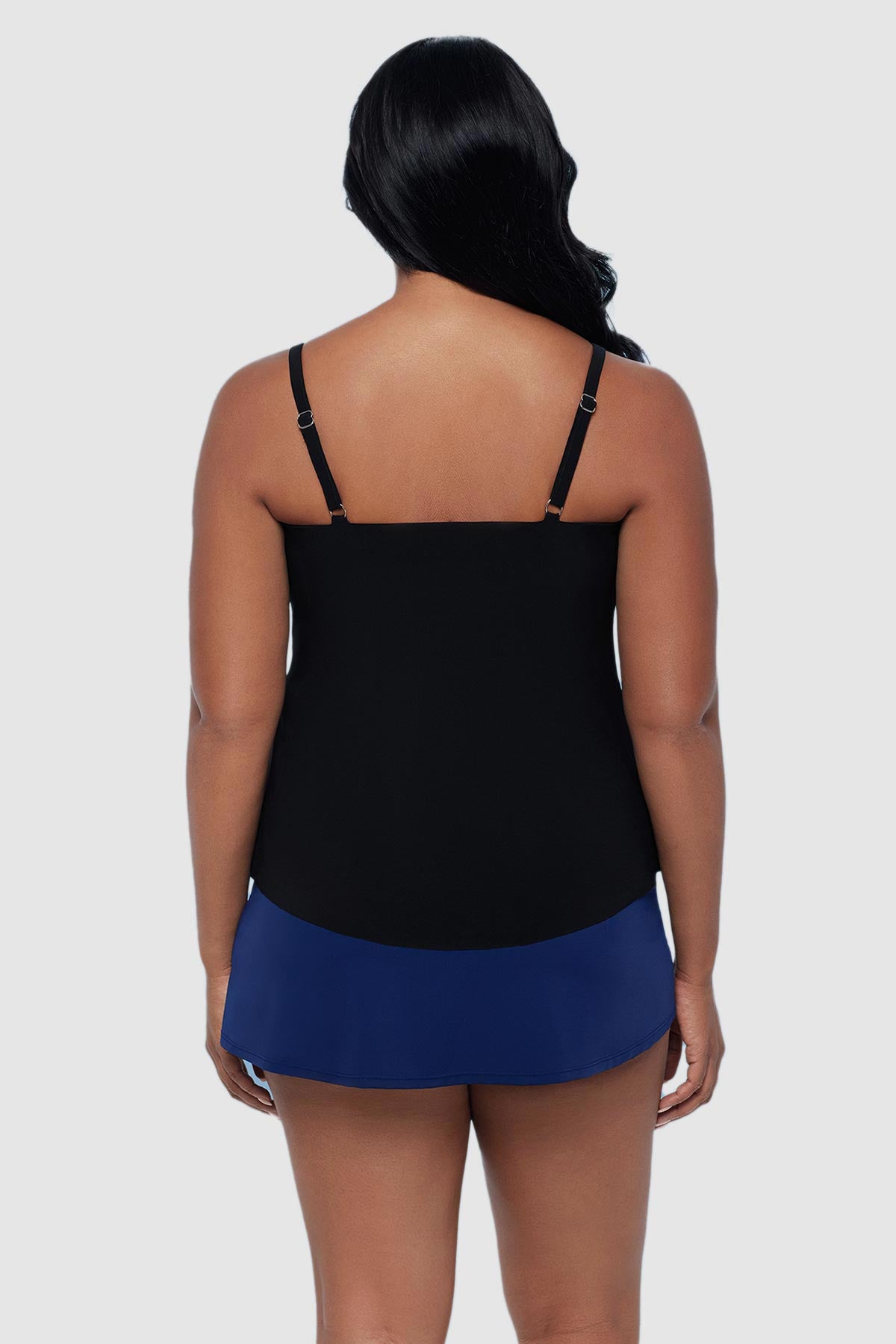 Woman turned away wearing a printed tankini top