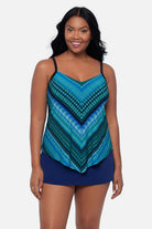 Woman wearing a geometric blue printed tankini top