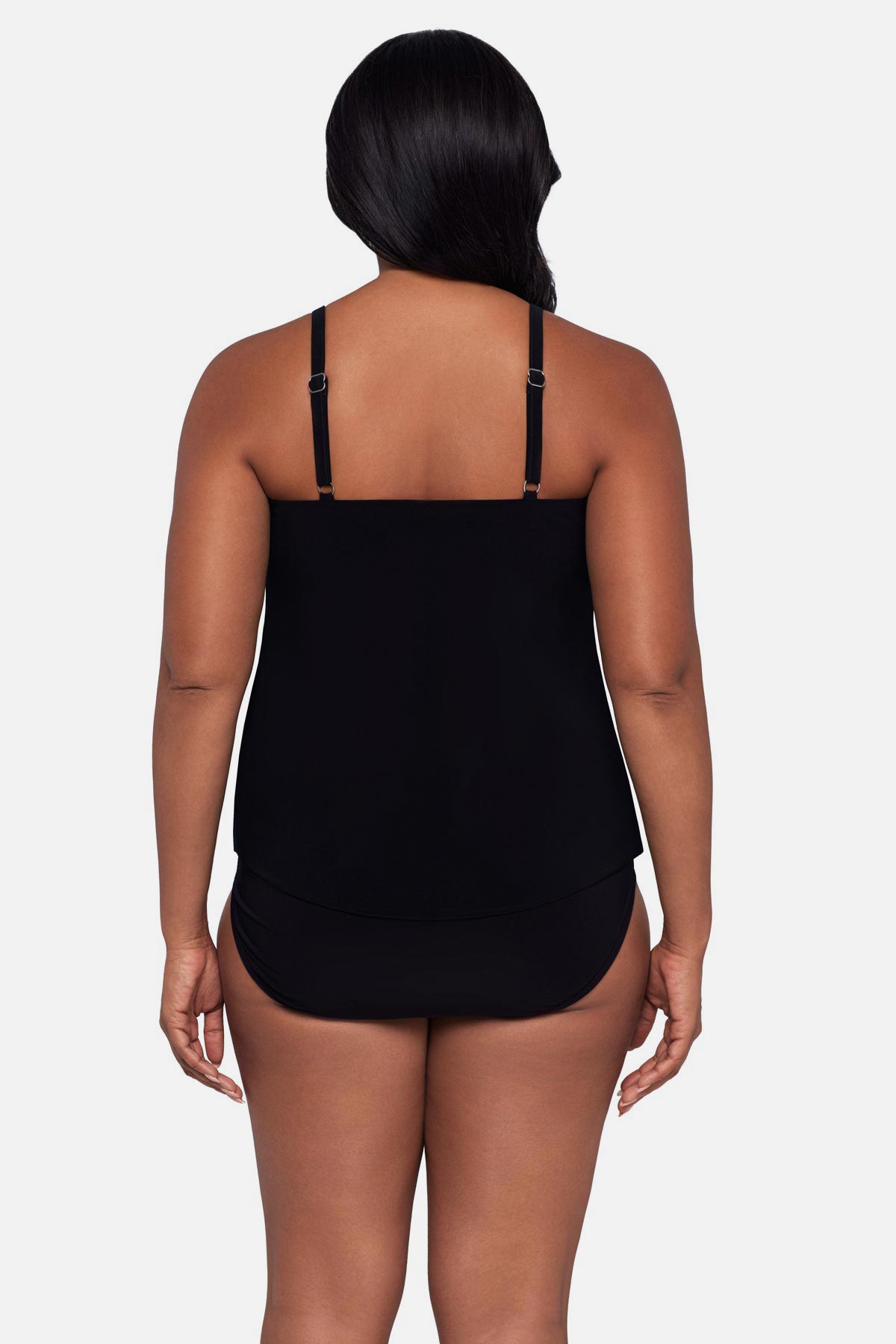 Woman turned away wearing a pink ombre tankini top
