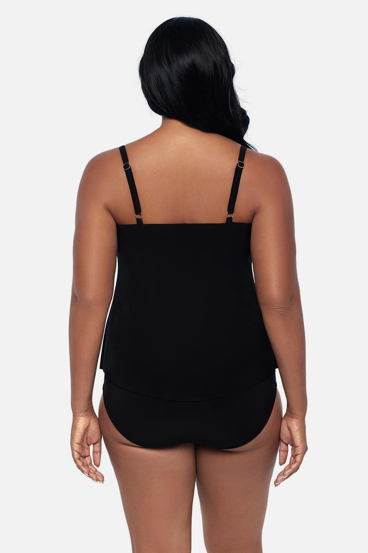 Woman turned away wearing a tankini top