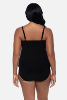 Woman turned away wearing a tankini top