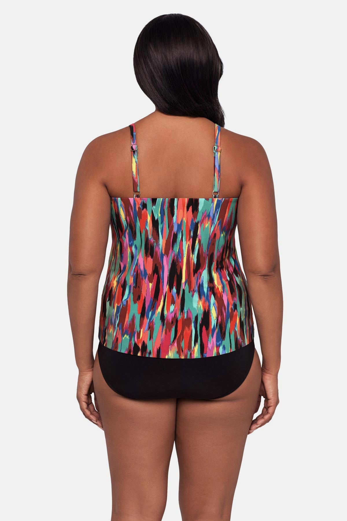 Woman turned away wearing an abstract multicolored printed tankini top