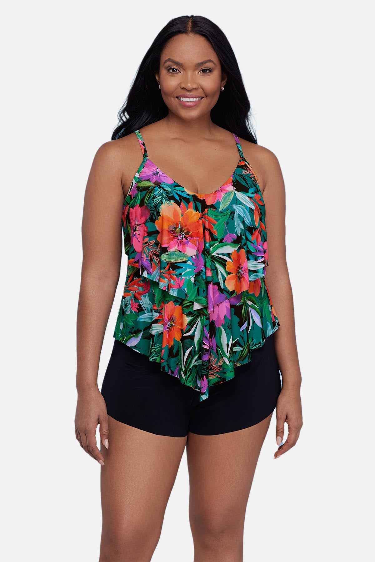 Woman wearing a multicolor floral and leaf print tankini top with ruffles