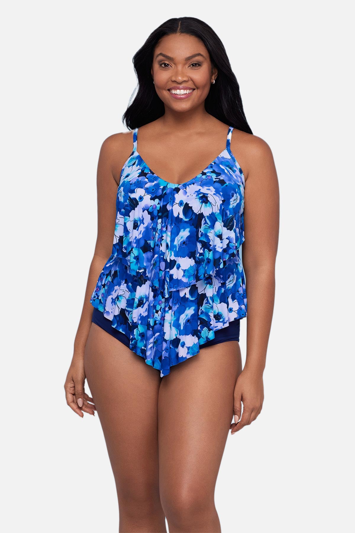 Woman wearing a blue and white floral pattern tankini top