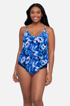 Woman wearing a blue and white floral pattern tankini top
