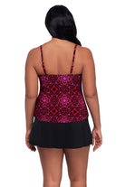 Woman turned away wearing a pink and red tile print tankini top