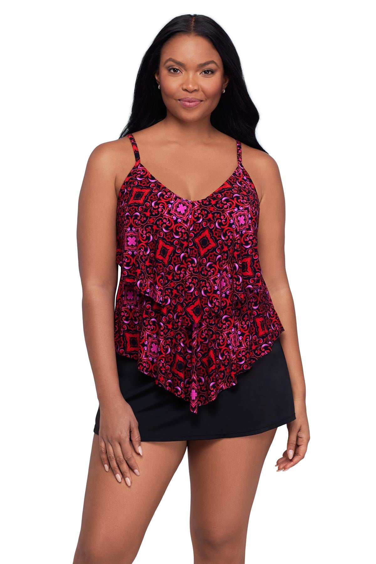 Woman wearing a pink and red tile print tankini top