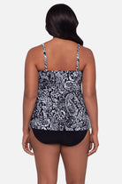 Woman turned away wearing a paisley printed black and white tankini top