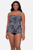 Woman wearing a paisley printed black and white tankini top