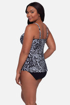 Woman turned left wearing a paisley printed black and white tankini top