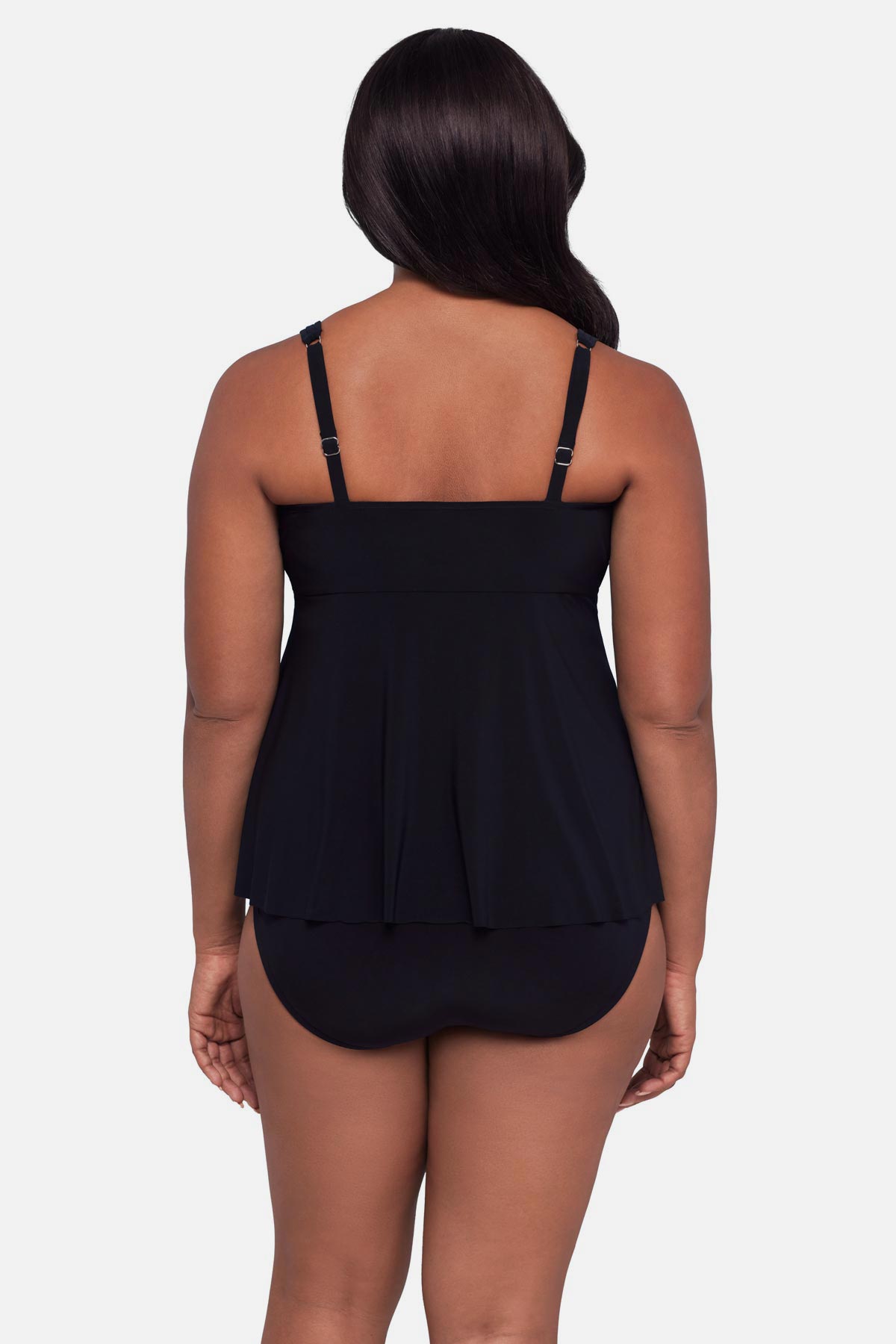 Woman turned away wearing a black  tankini top