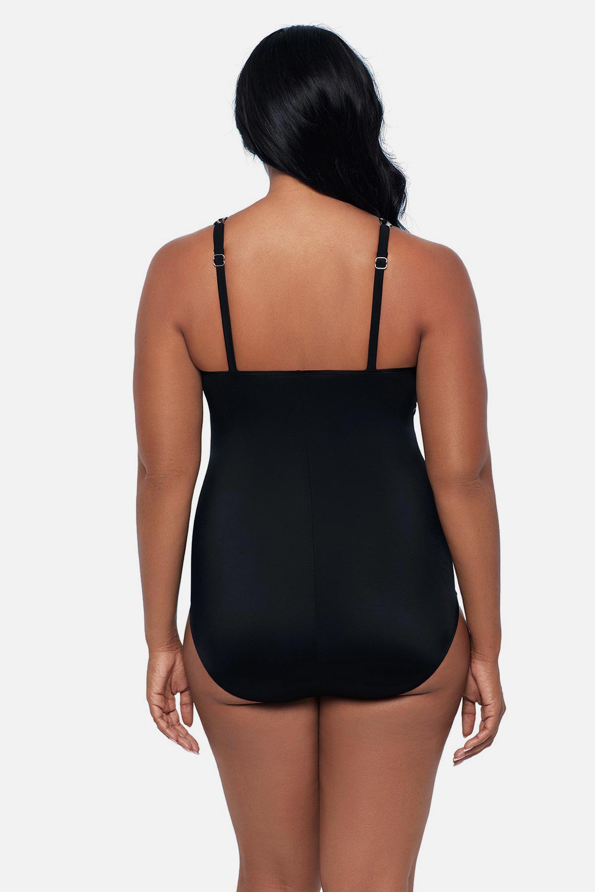 Woman turned away wearing an animal printed one-piece swimsuit 