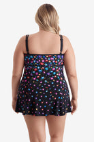 Woman turned away wearing a multicolored floral printed pattern swim dress