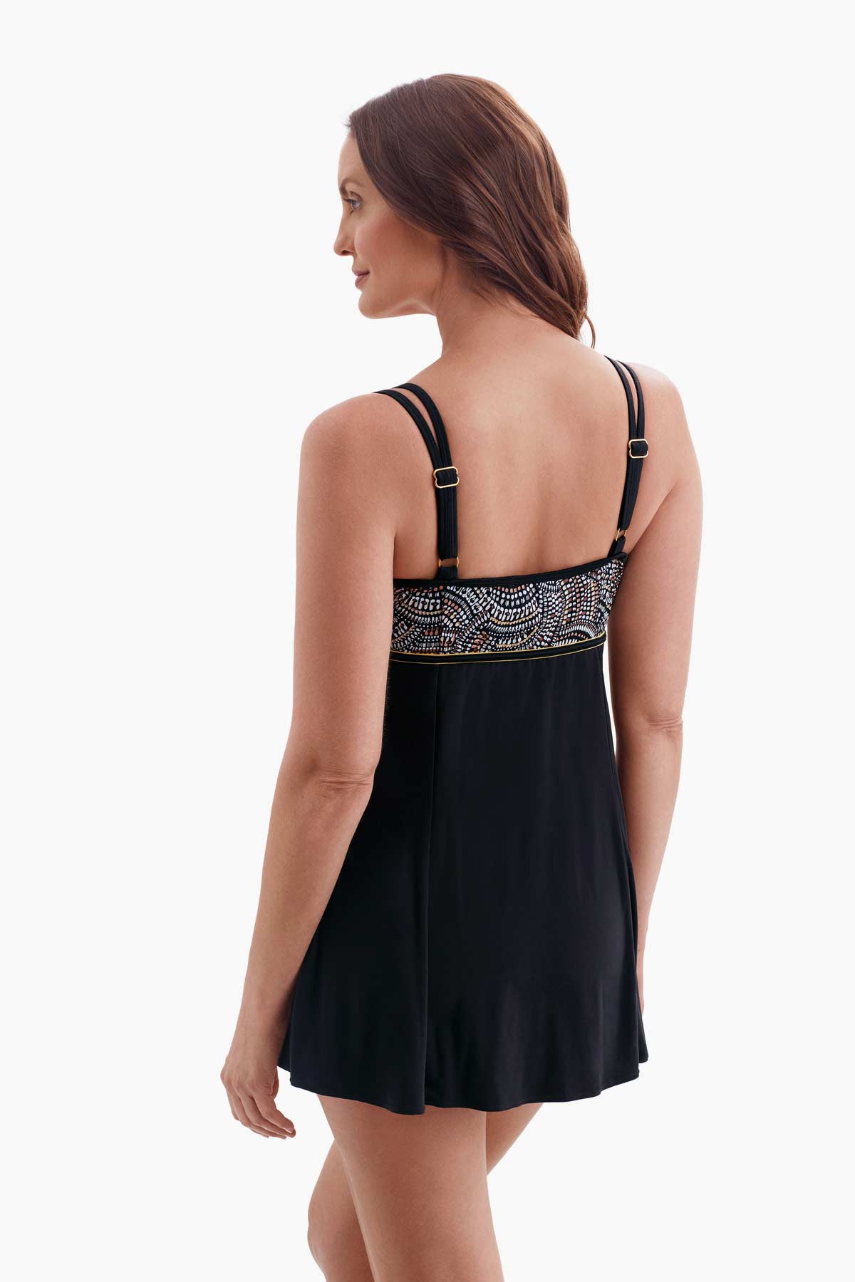 Woman turned left showing off straps of swim dress