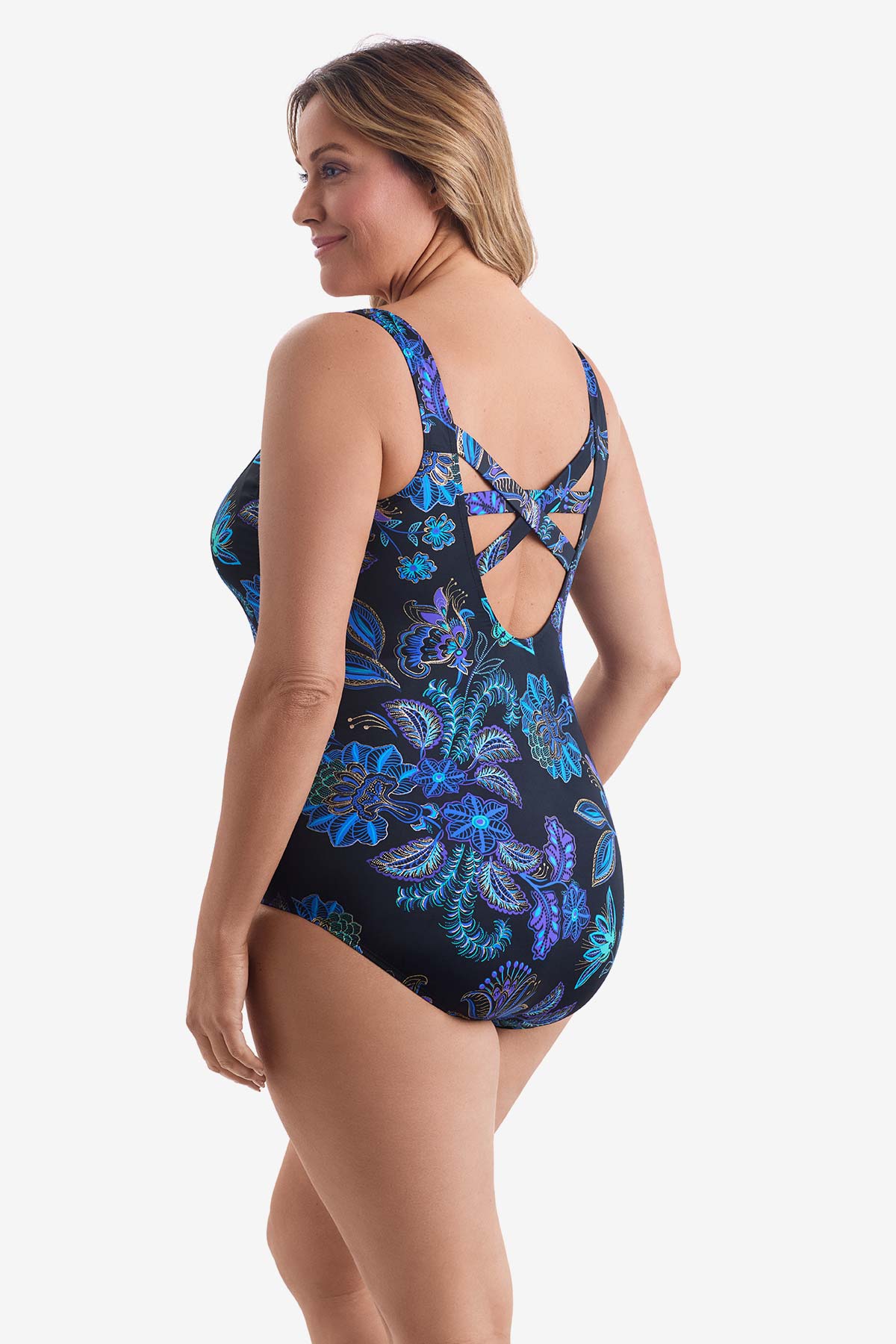 Woman turned left wearing a blue flower printed one-piece swimsuit