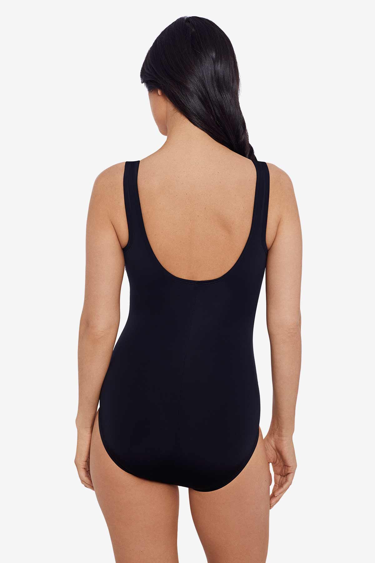 Woman faced away wearing a black one-piece swimsuit