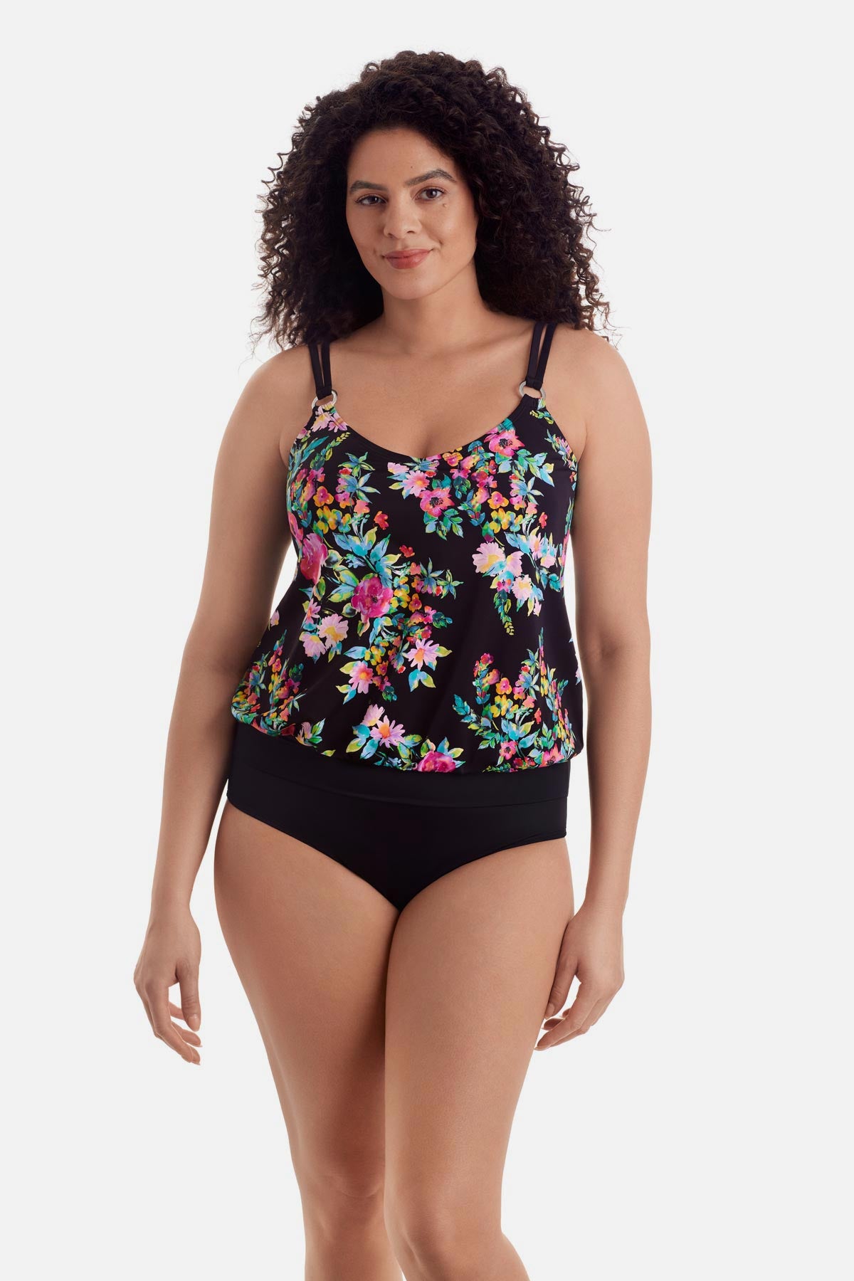 Woman wearing a multicolored floral printed blouson tankini top