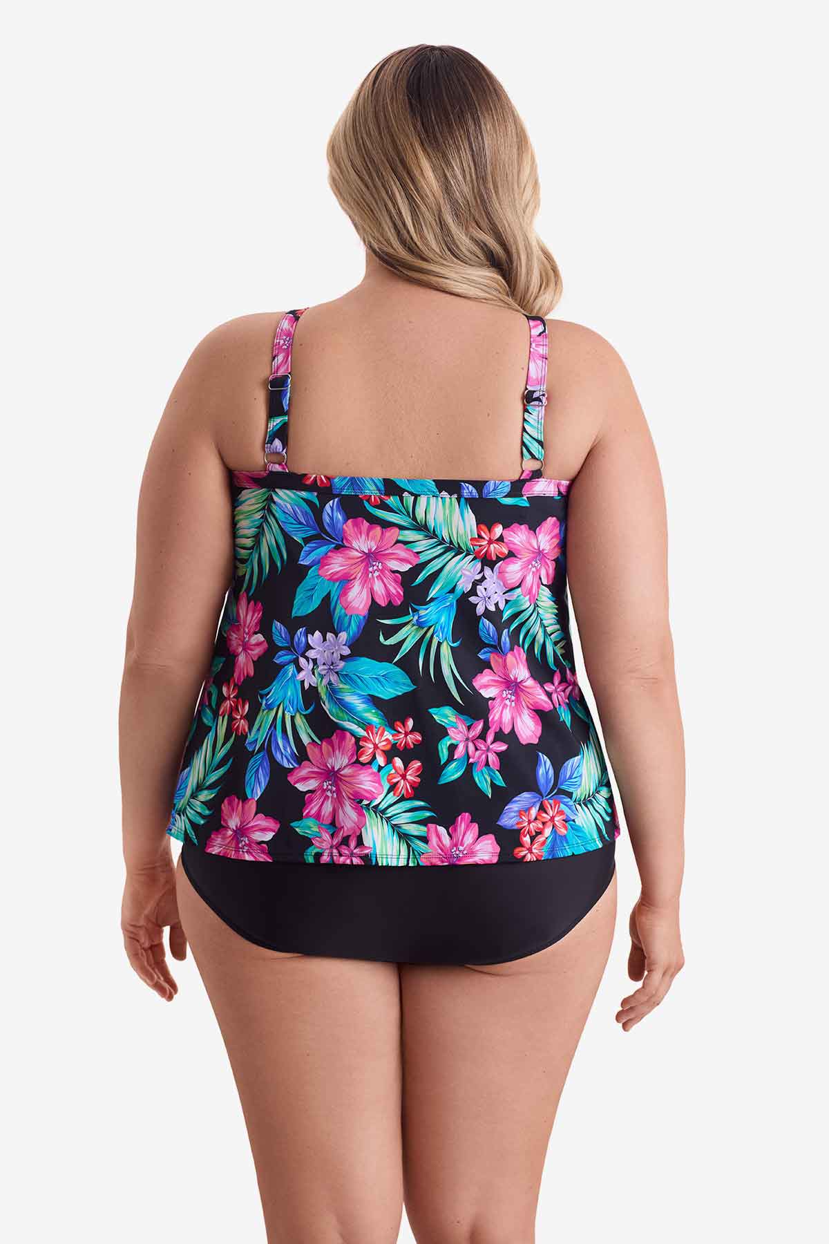 Woman faced away wearing a multicolored tropical printed tankini top