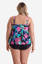 Woman faced away wearing a multicolored tropical printed tankini top