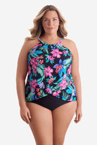Woman wearing a multicolored tropical printed tankini top