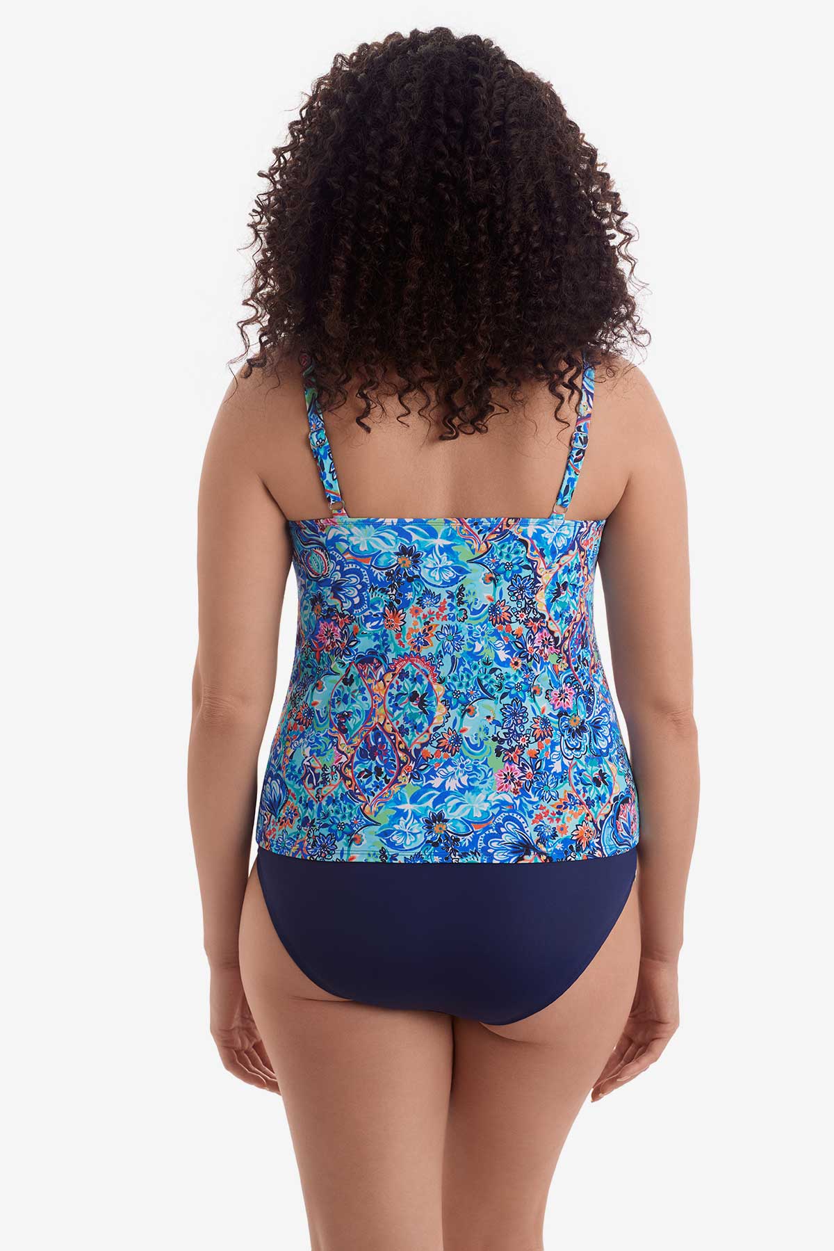 Woman faced away wearing a blue paisley-esque printed tankini top