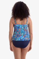 Woman faced away wearing a blue paisley-esque printed tankini top