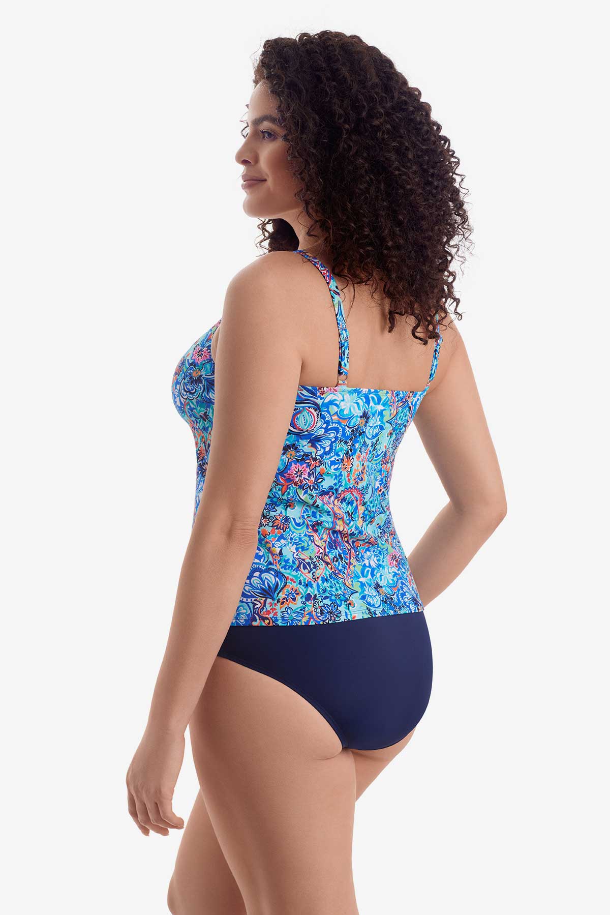 Woman faced left wearing a blue paisley-esque printed tankini top