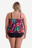 Woman wearing a multicolored floral printed blouson tankini top