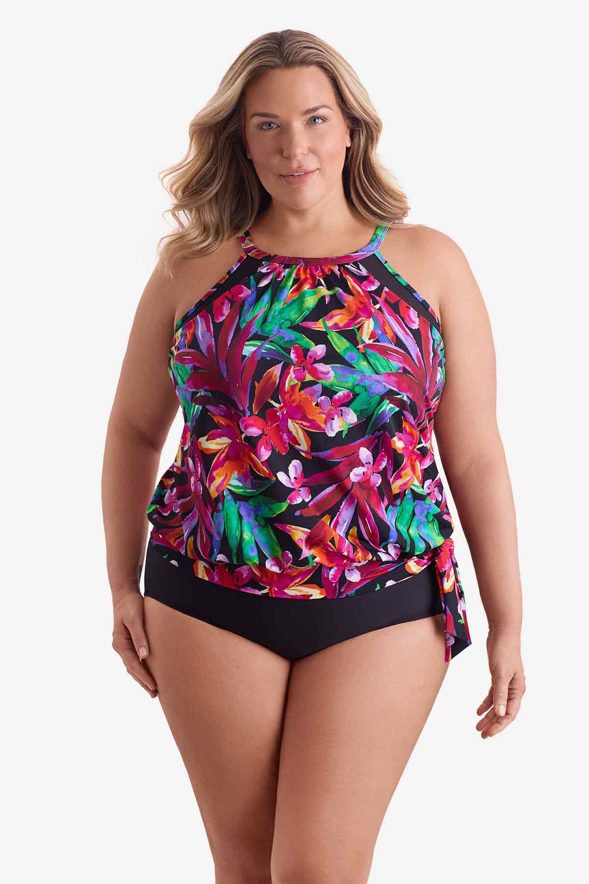 Woman wearing a multicolored floral printed high neck blouson tankini top