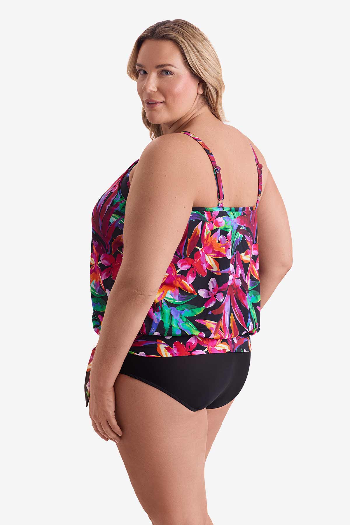 Woman faced left wearing a multicolored floral printed high neck blouson tankini top