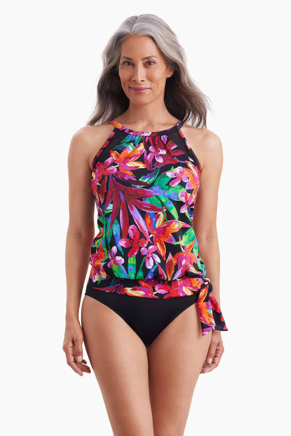 Woman wearing blouson style tankini top with multicolor floral print