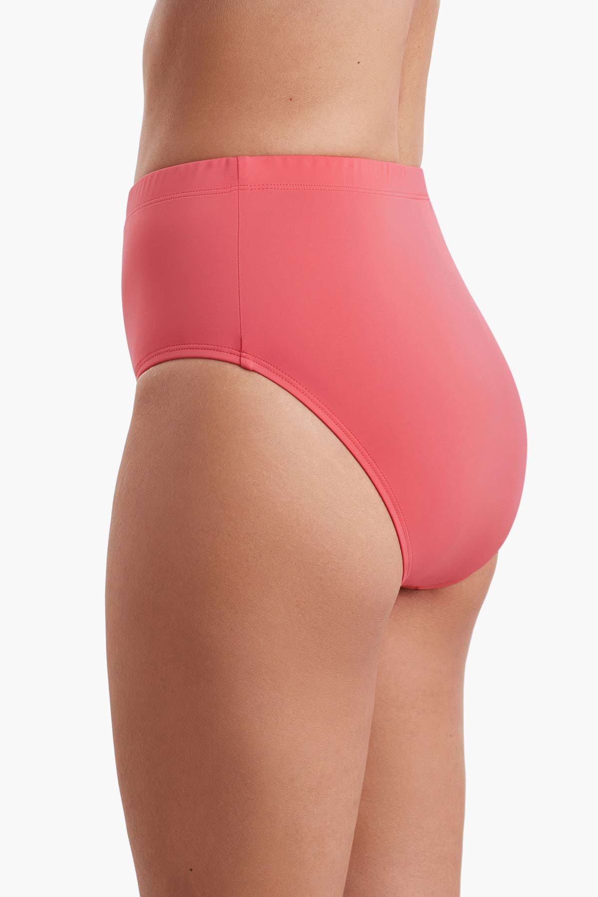 Side view of a coral pink basic brief swim bottom