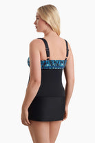 Woman faced left to show detail of tankini top