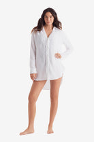 Woman wearing a white long sleeve button up shirt