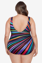 Woman turned away wearing a rainbow radial pattern one-piece swimsuit