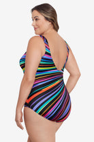Woman turned left wearing a rainbow radial pattern one-piece swimsuit