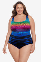 Woman wearing a rainbow ombre with a geometric overlay print one-piece swimsuit